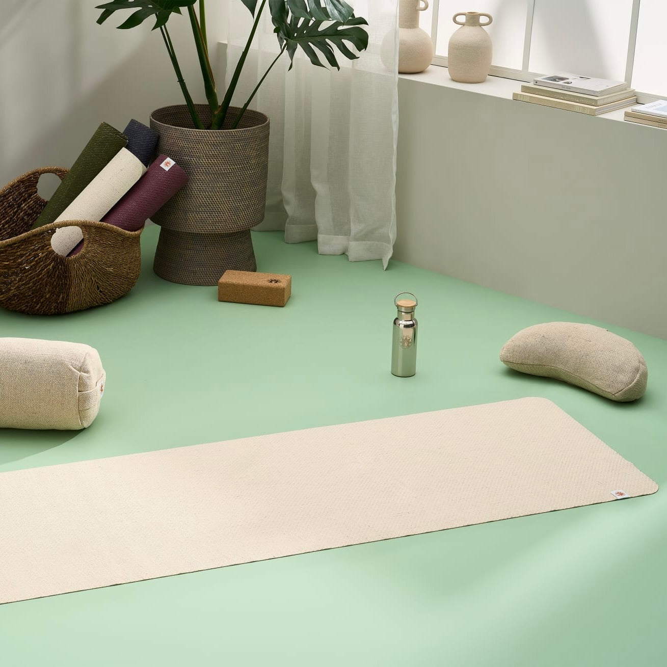 Lifestyle image of jute yoga mat, meditation cushion, yoga bolster, yoga blocks in a stylish modern home yoga studio #4mm-yoga-mat-colour_eco-natural-white