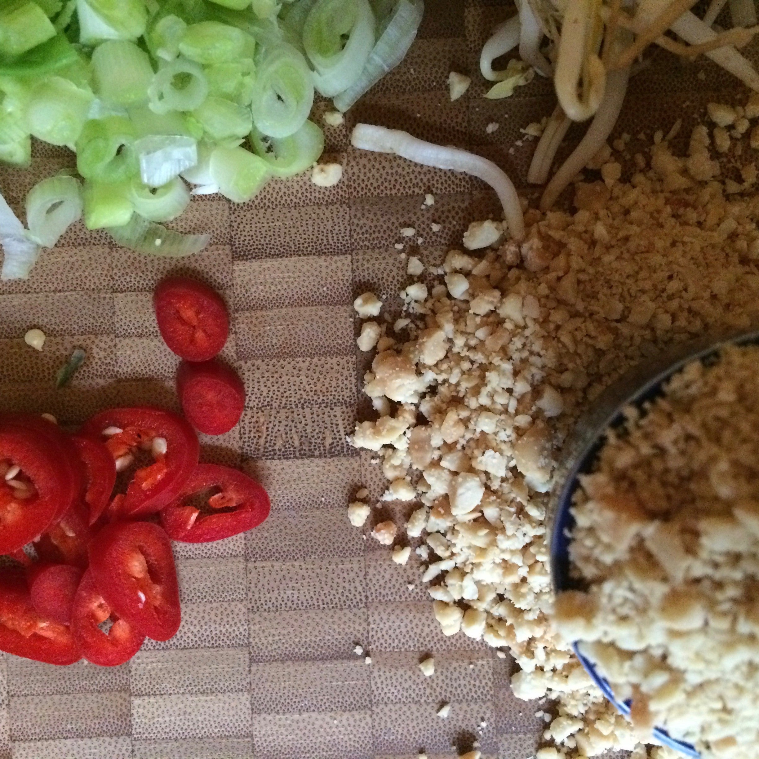 Vegan Pad Thai - Chili, Chopped Peatnuts and sprouts.