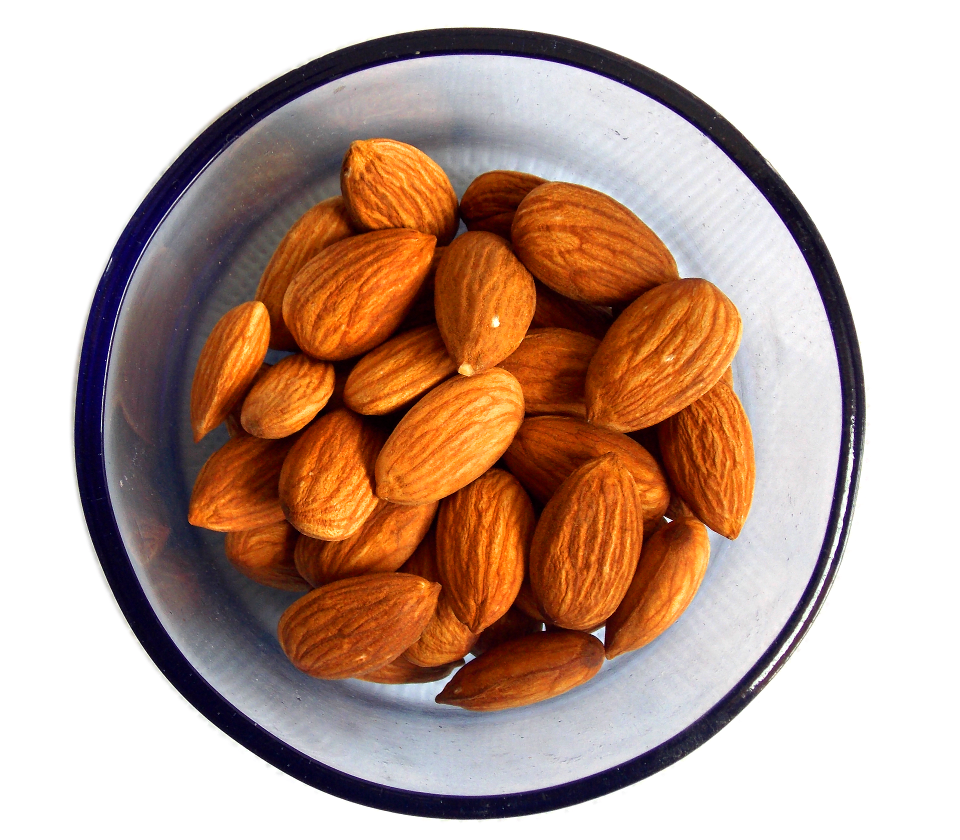 The best homemade almond butter - Roasted almond butter, almonds in a glass. 