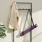 Lifestyle photo of jute yoga mat and yoga mat carrying strap ready to go in stylish modern home #4mm-yoga-mat-colour_new-majestic-purple
