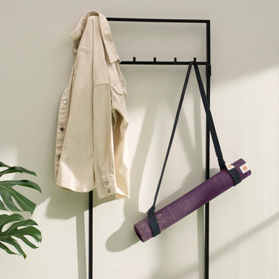 Lifestyle photo of jute yoga mat and yoga mat carrying strap ready to go in stylish modern home #4mm-yoga-mat-colour_new-majestic-purple