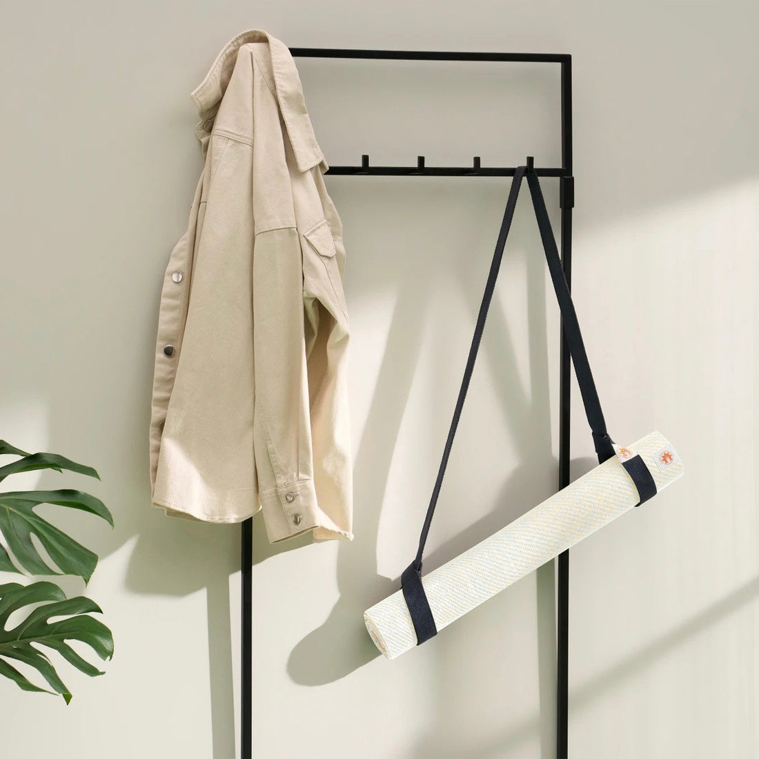 Lifestyle photo of jute yoga mat and yoga mat carrying strap ready to go in stylish modern home Eco Natural White #4mm-yoga-mat-colour_eco-natural-white