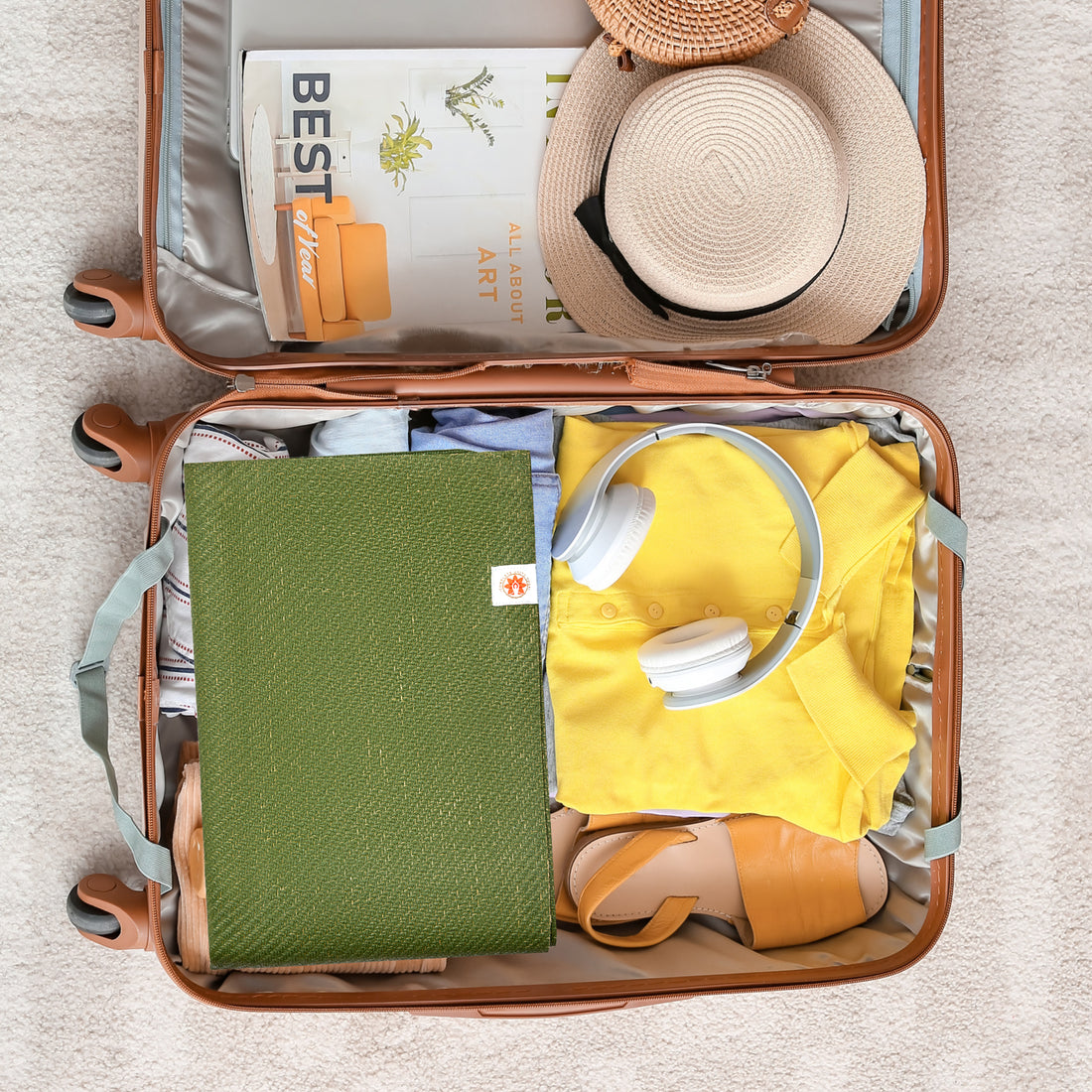 Yoga & Travel Mat Set | CompleteGrip™ Eco Friendly Jute Yoga Mat Set photograph of yoga mat packed in a suitcase for holiday #4mm-yoga-mat-colour_new-majestic-purple